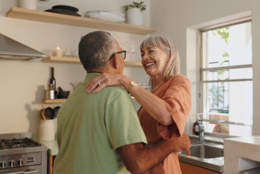 Happy old couple inside their home